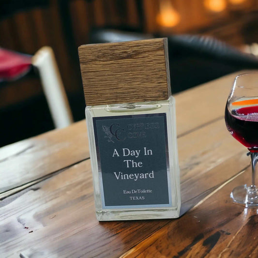 Bottle of vineyard-inspired perfume with citrus, lavender, and woody notes, handcrafted by Cypress Cove.
